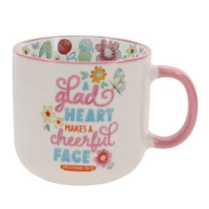 A Glad Heart Makes a Cheerful Face Ceramic Mug